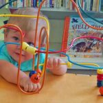 Toddler playing with a game