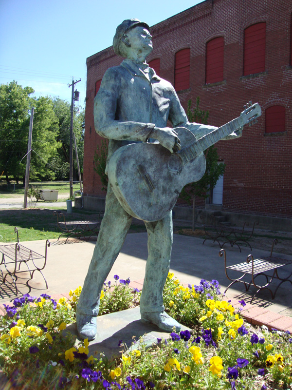 Woody statue strumming guitar